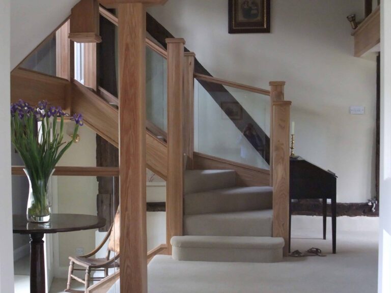 Customer's images of a glass and oak staircase with grey on stair carpet