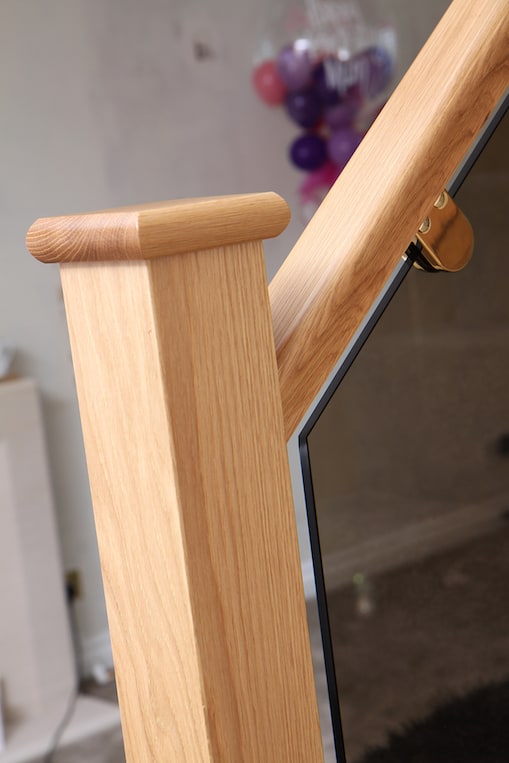 oak newel post with flat newel cap and bronze tinted 100mm glass stair balustrade
