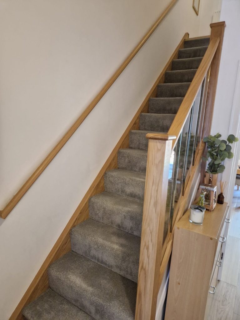 Oak staircase renovation with glass spindles in South London